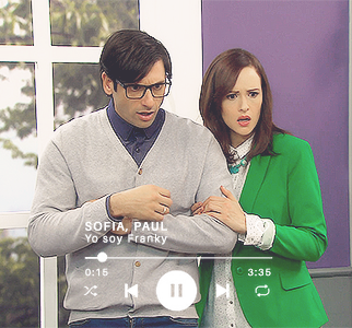 Sofía grabbing Paul by the arm. Both look shocked and are looking at something on the ground, out of frame.